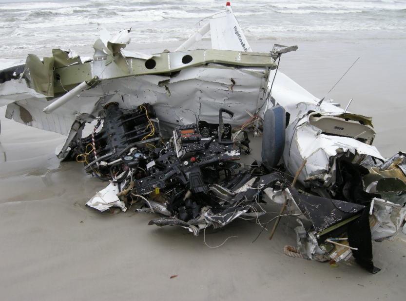 The wreckage of a Cessna 152 is seen on the beach in Florida.