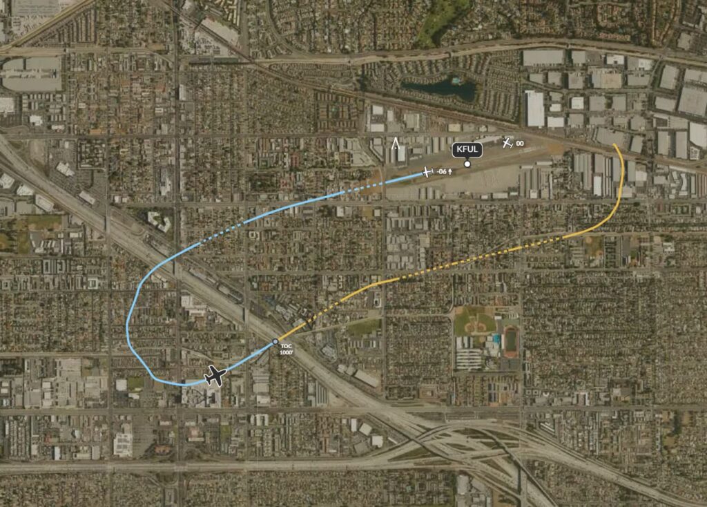 A satellite map of Fullerton, California, shows the flight path of an aircraft incident near Fullerton Municipal Airport (KFUL). The path is marked with a yellow dashed line for the initial takeoff and a blue solid line for the return attempt. The aircraft icon indicates the last recorded position before the crash. Various landmarks, roads, and industrial areas are visible in the background.