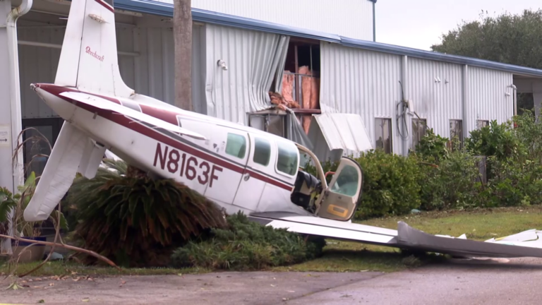 A personal aircraft crashed into a grey building